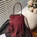 Ethnic style wine red suede bucket bag with long tassels and adjustable strap - Burgundy