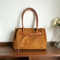 Brown suede tote bag with golden buckle detail and elegant smooth leather shoulder straps - Brown