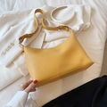 Minimalist ginger yellow hobo shoulder bag in lychee pattern leather with knotted strap - Yellow