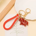 Traditional red Chinese zodiac horse keychain with woven rope and golden metal heart - Leather Rope Pendant / Red