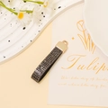 Detail of dark grey glitter leather keychain with gold metal hardware and daisy decor - Dark Gray