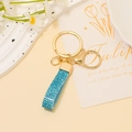 Porte-clés en cuir à paillettes bleu clair avec fermoir en métal doré et anneau en D - Bleu Clair Paillette