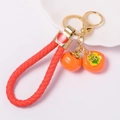 Creative orange persimmon keychain with red woven rope and gold heart charm on white - Red Rope Orange Persimmon