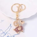 Vista dettagliata del portachiavi pecora zodiacale con strass bianchi e viola - Viola/Bianco