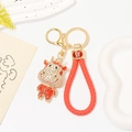 Portachiavi mucca zodiaco cinese con strass, placcatura in oro e corda rossa - Pendaglio Mucca Strass + Corda Intrecciata Rossa