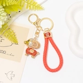 Porte-clés mouton du zodiaque doré avec cordon en cuir rouge et accents de strass - Mouton Rouge avec Corde Tressée