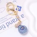 Porte-clés doré avec pendentif sac de fortune en strass bleus et caractère chanceux - Sac de Chance Bleu Foncé