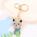 Detailed macro view of cat keychain with blue rhinestones and gold lobster clasp - Sky Blue