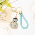 Portachiavi borsa della fortuna con strass e cordino in pelle intrecciata azzurro chiaro - Blu Con Corda Intrecciata