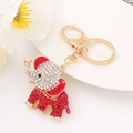 Exquisite elephant keychain with sparkling red and white rhinestones on gold metal - Red