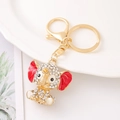 Detailed macro view of golden elephant keychain with sparkling white rhinestones and red ears - White Rhinestone Red Ear Style (Style 1)
