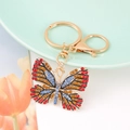 Sparkling crystal butterfly keychain with colorful rhinestones on a golden ring - Color 1
