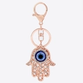 Hamsa Hand Schlüsselanhänger in Roségold mit Evil Eye und funkelnden Kristallen - Roségold