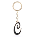 Detail view of letter C keychain with gold metal base and black enamel finish - Letter C
