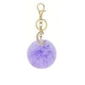 Close-up of a purple faux fur ball keychain with a gold rhinestone-encrusted letter C charm - Purple C