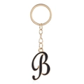 Detail of cursive letter B keychain with black enamel finish and golden metal ring - Letter B