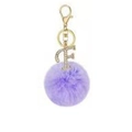 Close-up of purple faux rabbit fur pompom with crystal letter F keychain pendant - Purple F