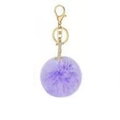 Detail of a purple faux fur pom-pom keychain with gold hardware and sparkling letter I charm - Purple I
