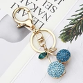 Macro detail of cherry keychain featuring gradient blue rhinestones and gold hardware - Lake Blue
