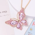 Elegant gold butterfly keychain with pink rhinestones and pear-shaped crystals on white stand - Necklace / Pink