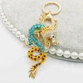 Golden Chinese dragon keychain pendant with vibrant blue and red crystal rhinestones - Blue