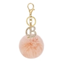 Pink faux rabbit fur pom pom keychain featuring a gold rhinestone letter B charm - Letter B