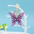 Squisito portachiavi a farfalla viola con strass colorati e chiusura a moschettone dorata - Violetto