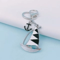 Creative nautical alloy keychain with colorful sailboat and black anchor charms - Black Sailboat Style