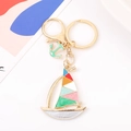 Detailed view of colorful sailboat keychain with gold alloy frame and anchor charm accessory - Multicolor Sailboat Style