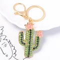 Portachiavi a cactus scintillante con strass verdi e fiori rosa su base in metallo dorato - Stile Verde