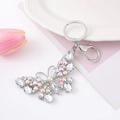 Detail of butterfly keychain with sparkling rhinestones and silver-tone lobster clasp hardware - Silver Iridescent Style