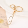 Close-up of gold letter J keychain with sparkling white rhinestones and a lobster clasp - Letter I(I) / Gold