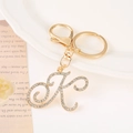 Detailed view of a gold-plated letter K keychain with inlaid rhinestones and lobster clasp - Letter K(K) / Gold