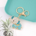 Macro detail of elephant keychain with sparkling blue and white rhinestones on golden alloy - Lake Blue Full Diamond Elephant Charm (Color 8)