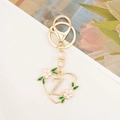 Detailed macro view of heart-shaped letter Z keychain with white rhinestones and pink floral - Letter Z Style