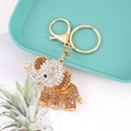 Detail of crystal elephant keychain with champagne rhinestones on a teal tray - Amber Color Full Diamond Elephant (Color 11)