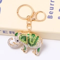 Detail shot of golden elephant keychain with sparkling rhinestones and green enamel accents - Green Enamel Full Diamond Elephant (Color 15)