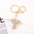 Detailed view of luxury gold crystal letter Y keychain with sparkling rhinestones - Letter Y