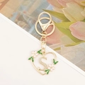 Detail of gold heart keychain with sparkling letter S, pink flowers and lobster clasp - Letter S Style
