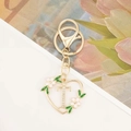Detail of heart keychain with gold T-letter pendant, crystals and floral enamel - Letter T Style