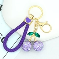 Portachiavi a ciliegia viola con strass brillanti e gancio dorato in metallo - Ciliegia in Strass con Cordino Viola / Viola