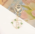 Golden heart-shaped letter P keychain with rhinestones and floral enamel charm - Letter P Style