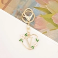 Golden heart-shaped keychain with letter V, pink enamel flowers and rhinestone details - Style Letter V