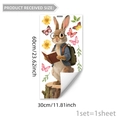 Cartoon rabbit reading book window cling decal with floral and butterfly accents - Rabbit with Backpack Reading (D20556)