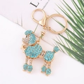 Portachiavi cane barboncino con strass azzurri brillanti e finitura in metallo dorato - Azzurro