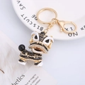 Chinese lion dance keychain in black and gold alloy with sparkling rhinestones - Black