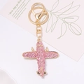 Flugzeug-Schlüsselanhänger mit rosa Strasssteinen und goldener Metallbasis - Rosa Strass (Farbe 2)
