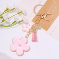 Pink enamel flower keychain with tassel and rhinestone butterfly pendant in gold finish - Light Pink