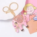 Pink enamel elephant keychain with sparkling rhinestones and golden metal hardware - Pink