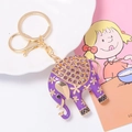 Detailed macro view of a purple elephant keychain featuring sparkling rhinestones and enamel - Purple